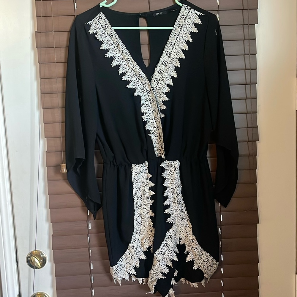 Black with white lace trim romper